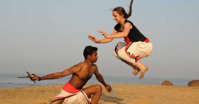man and a woman practising Kalarippayauttu.