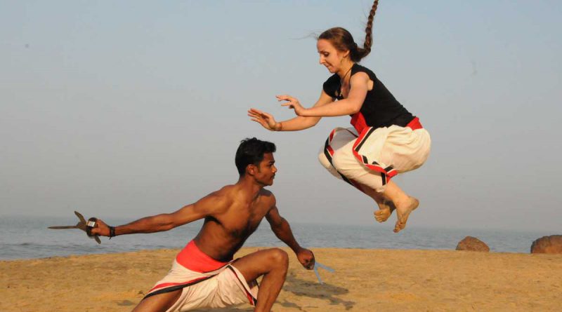 man and a woman practising Kalarippayauttu.